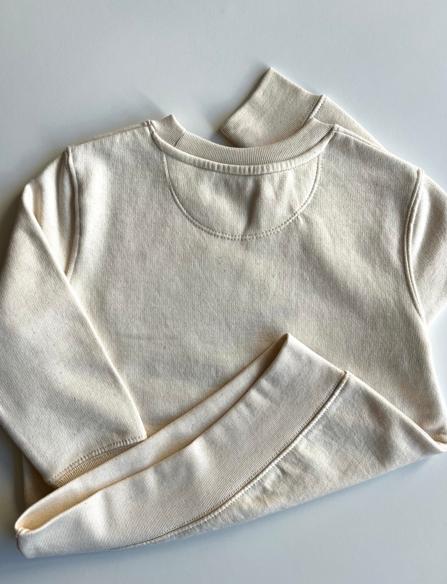 Sweater "The World- bestickt" (Beige meliert)