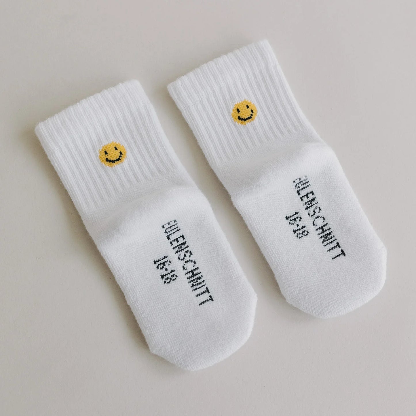 Eulenschnitt Babysocken "Smiley" (Weiß)