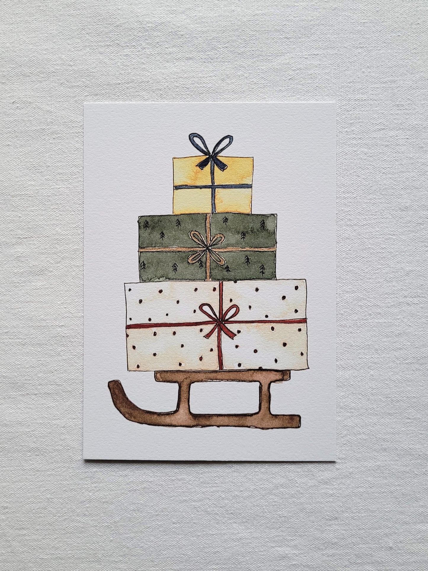 Postkarte "Geschenkeschlitten" (handgemalt)